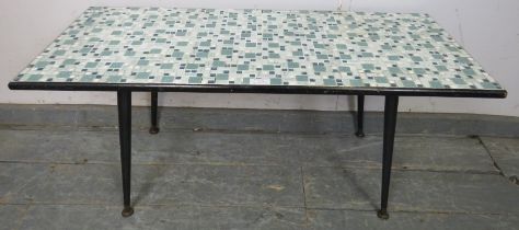 A vintage mid-century rectangular side table with inset mosaic tiles in variegated shades of blue