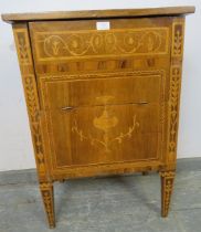 An 18th century Italian walnut commode cabinet, having olivewood crossbanding and marquetry inlay in
