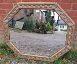 A decorative period-style octagonal wall mirror, 20th century, gilt and paint effect finish. 90cm