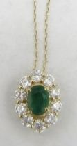 An 18ct fine gold necklace with oval cut emerald & round brilliant cut diamond cluster pendant,