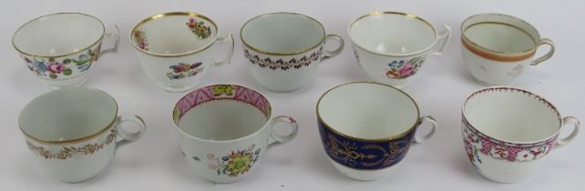 A group of Newhall blue and white and polychrome painted tea cups, early 19th century. Tallest