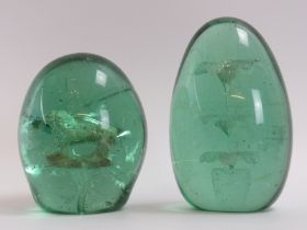 Two Victorian green glass dump paperweights. (2 items) 13 cm height, 10.5 cm height. Condition