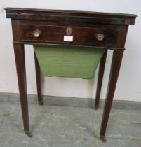 A Regency Period rosewood turnover worktable, the folding top over one long frieze drawer with