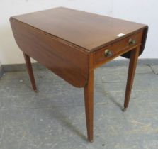 A George III mahogany Pembroke table, having reeded edge, with one cock-beaded drawer and one