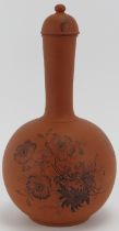 A Victorian Watcombe terracotta bottle vase and cover with floral decoration, circa 1880s. 29 cm