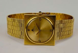 An 18ct yellow gold Jaeger-LeCoultre wristwatch with square dial and integrated 18ct gold