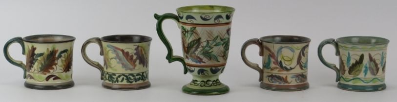 A group of five Denby foliate decorated pottery cups by Glyn Colledge, mid 20th century. Signed