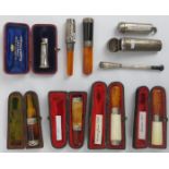 Tobacconalia: A group of eight silver mounted cheroot holders and two silver cheroot cases, early
