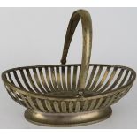 A French silver bonbon basket of oval strap work form with hinged handle. Bears French silver marks.
