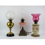 Three British antique brass, ceramic and glass oil lamps, late 19th/early 20th century. Comprising a