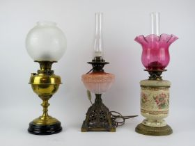 Three British antique brass, ceramic and glass oil lamps, late 19th/early 20th century. Comprising a