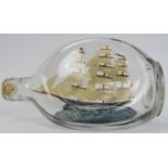 A vintage model Clipper ship in a glass Haig’s whisky bottle by ‘Ship Models’ of Robin Hood Bay.