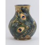 A Moorcroft ‘Phoenix’ pattern vase designed by Rachel Bishop, dated 1997. Tubeline decorated with