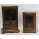 Tobacconalia: An oak smokers cabinet and a walnut and mahogany shakers cabinet, early 20th