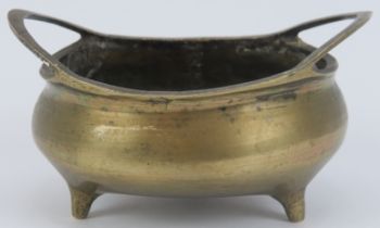 A Chinese polished bronze bombe censer, 19th century. Imperial Xuande (1426 - 1435) reign mark in