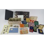 A large collection of Britiush, European and world coins including proof sets, commemorative £2