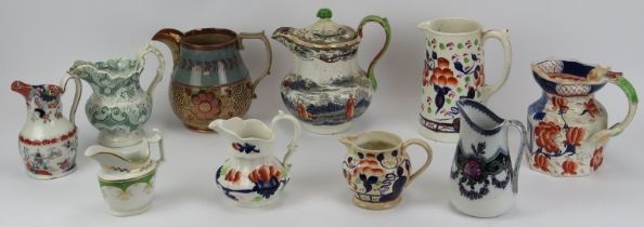 Ten Victorian ironstone and lustreware jugs, mid/late 19th century. 22 cm tallest height.