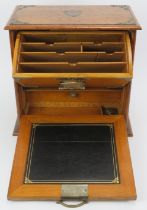A late Victorian brass mounted oak desktop stationary box. With internal letter rack, draw, pen