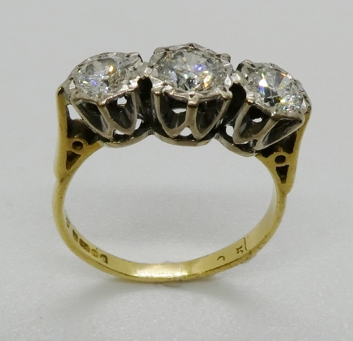 A three stone diamond ring, the graduated round brilliant cut diamonds illusion set in platinum - Image 3 of 4