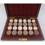 A Franklin Mint ‘Battle of Waterloo Checkers Set’. The hinged cover opening to reveal twenty four