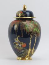 A Carlton Ware ‘New Stork’ pattern vase and cover. 28.2 cm height. Condition report: Good condition.