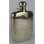 A 1920s silver hip flask with removable silver cup. Hallmarked for Birmingham 1920, maker Hubert