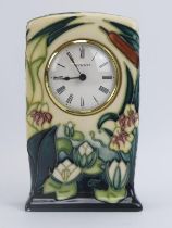 A Moorcroft ‘Lamia’ pattern vase mantel clock designed by Rachel Bishop, circa 1996. Painted and