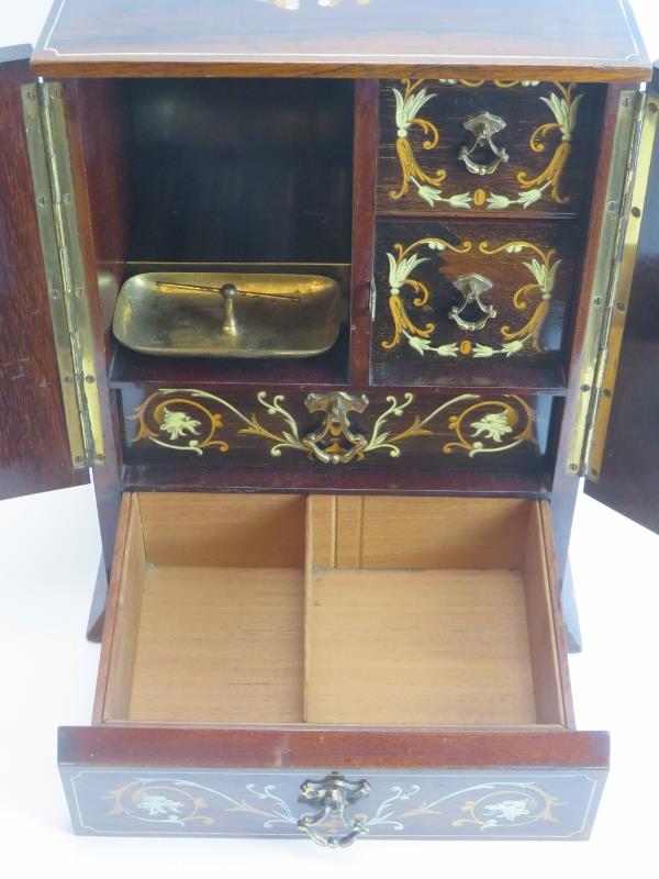 Tobacconalia: An Edwardian rosewood and marquetry inlaid smokers cabinet. Decorated with cherubs, - Image 7 of 8