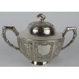 A late 19th century Chinese silver covered sucrier with embossed panels and bamboo style handles and