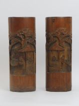 Two Chinese carved bamboo brush pots, 20th century. Depicting figures in a pavilion setting with