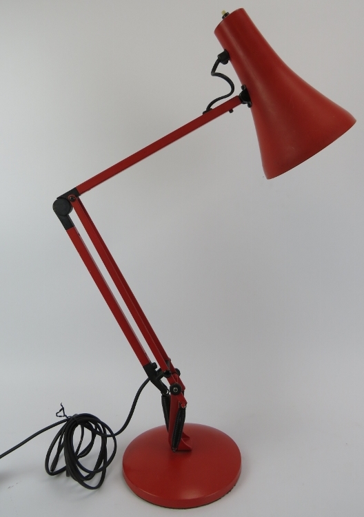 A vintage red anglepoise lamp, late 20th century. Base: 18 cm diameter. Condition report: Some age