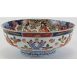 A Japanese Imari bowl, Meiji period. Profusely decorated throughout. Signed beneath. 18.5 cm