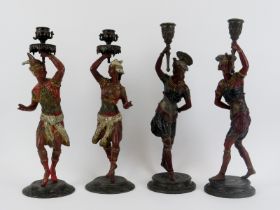 Two pairs of Continental cold painted spelter figural candlesticks, late 19th century. Each pair