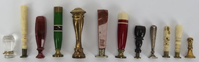 A group of vintage and antique seals, 19th century and later. Glass, stone, gilt metal, silver,
