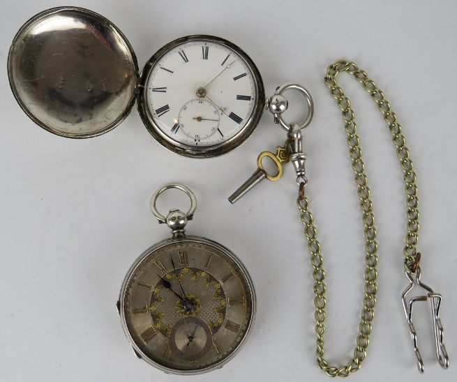 A Victorian silver cased full hunter pocket watch and a similar silver cased pocket watch by Thos