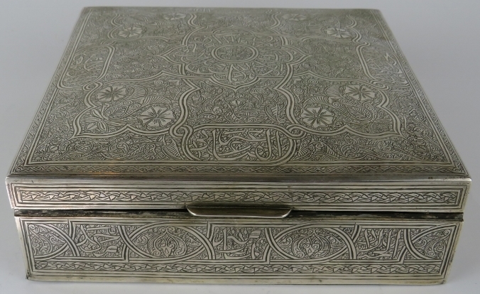 A large Egyptian white metal trinket box with finely engraved decoration of Islamic form. Bears