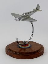 Aviation memorabilia: An RAF Spitfire desktop ornament, mid 20th century. Modelled in chrome and