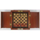 A travellers miniature cased chess set, early 20th century. The box unfolds to reveal a set of