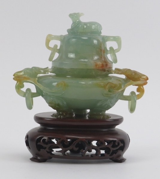 A Chinese carved jadeite tripod censer and cover, 20th century. Decorated with deer head ring