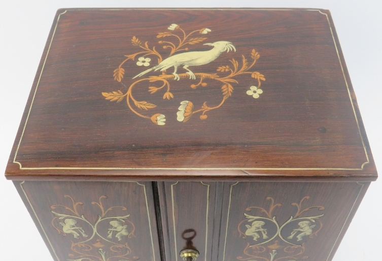 Tobacconalia: An Edwardian rosewood and marquetry inlaid smokers cabinet. Decorated with cherubs, - Image 2 of 8