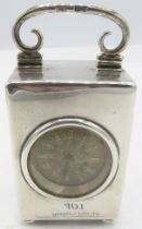 A small silver cased travelling clock on ball feet, London 1895. Approx 3"/8cm high. Condition