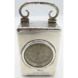 A small silver cased travelling clock on ball feet, London 1895. Approx 3"/8cm high. Condition