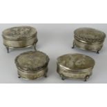 Four early 20th century silver ring boxes, one with Reynold's angels decoration. Various dates and