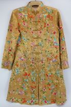 A Chinese embroidered silk jacket, 20th century. Profusely embroidered with birds, flowers and