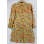 A Chinese embroidered silk jacket, 20th century. Profusely embroidered with birds, flowers and