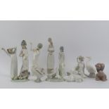 A collection of Lladro, Nao and Miguel figurines. (12 items) 26.5 cm tallest height. Condition