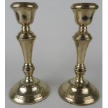 A pair of silver column candlesticks, hallmarked for Birmingham 1970, maker Broadway & Co. Height