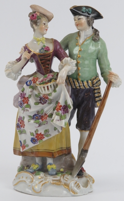 A Meissen porcelain gardener and female companion figural group, 19th century. Incised 37, impressed