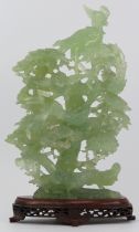 A large Chinese translucent jade carving, 20th century. Carved in openwork depicting pheasants in