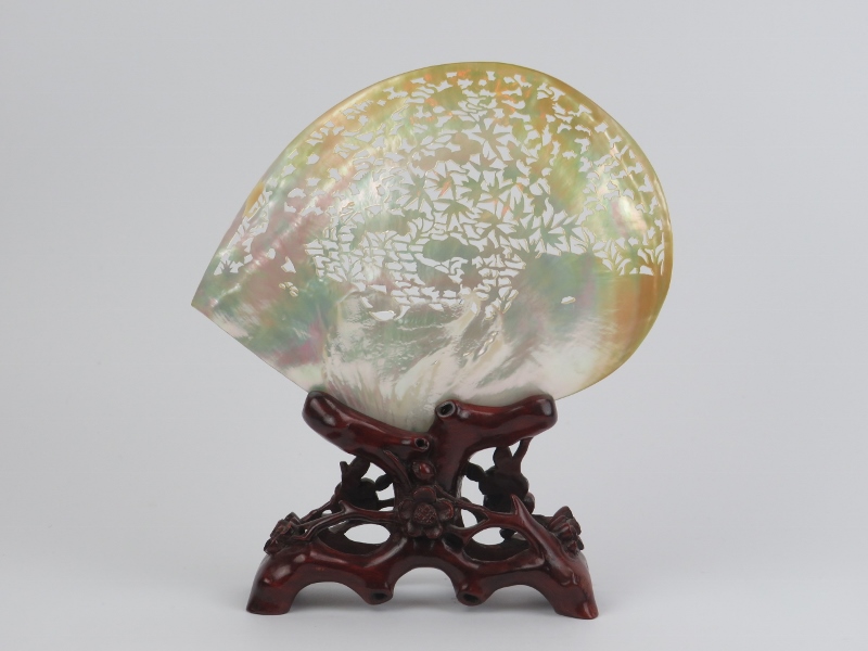 A large Chinese carved and pierced mother of pearl shell mounted on a carved wood stand, mid/late - Image 2 of 3